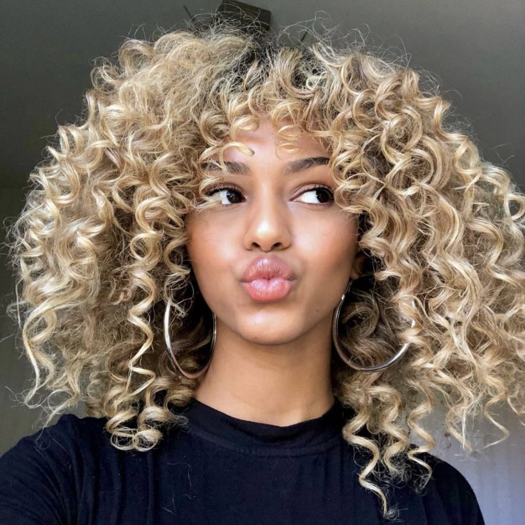 Simple Curly Hair With Curtain Bangs And Layers for Rounded Face