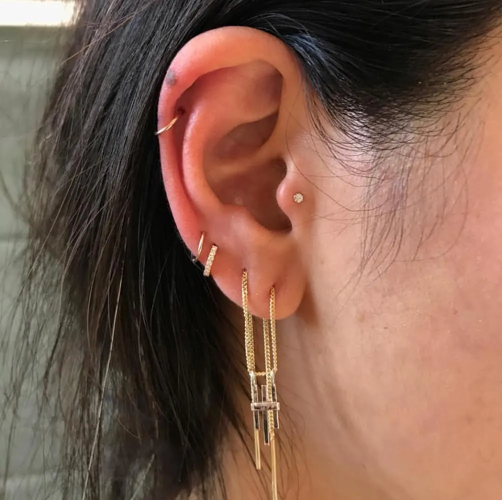 Tragus piercing: pain, healing, jewelry - obsidian piercing