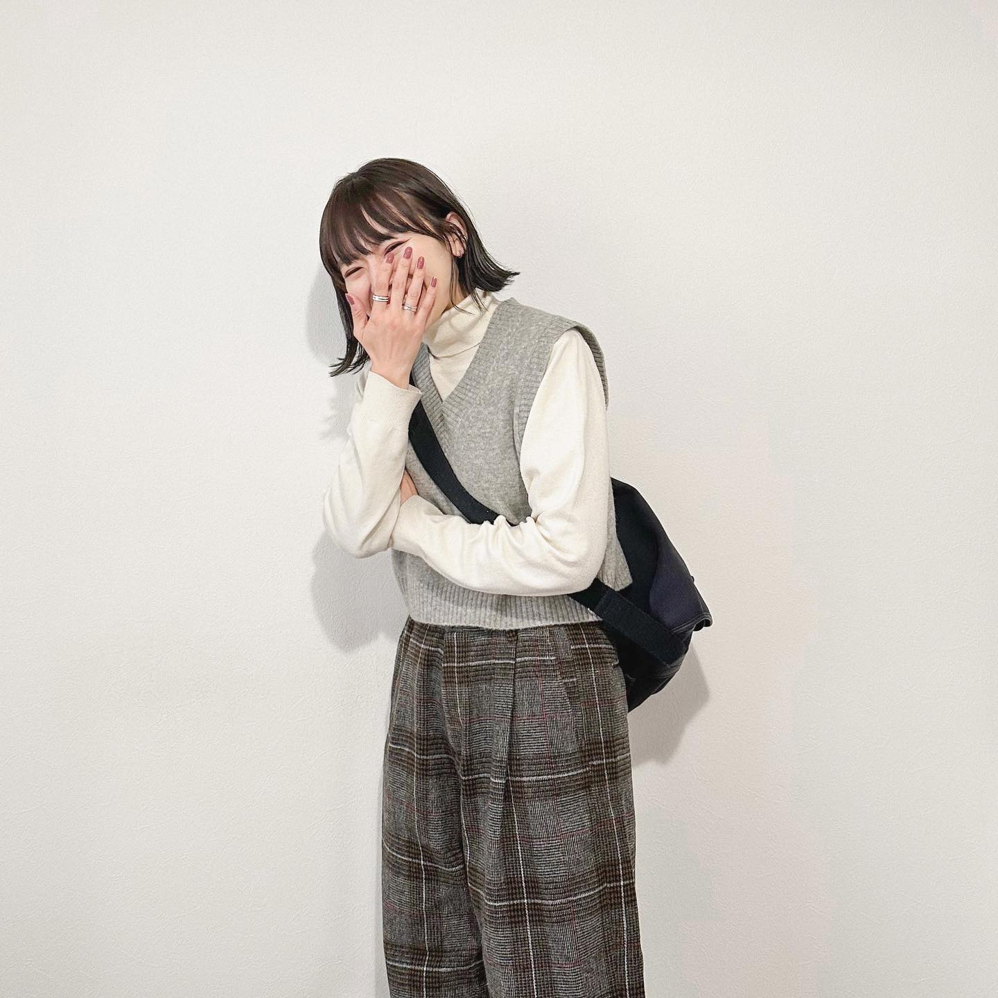 Pair Plaid Pant With Knit Vest and Turtle Neck Shirt