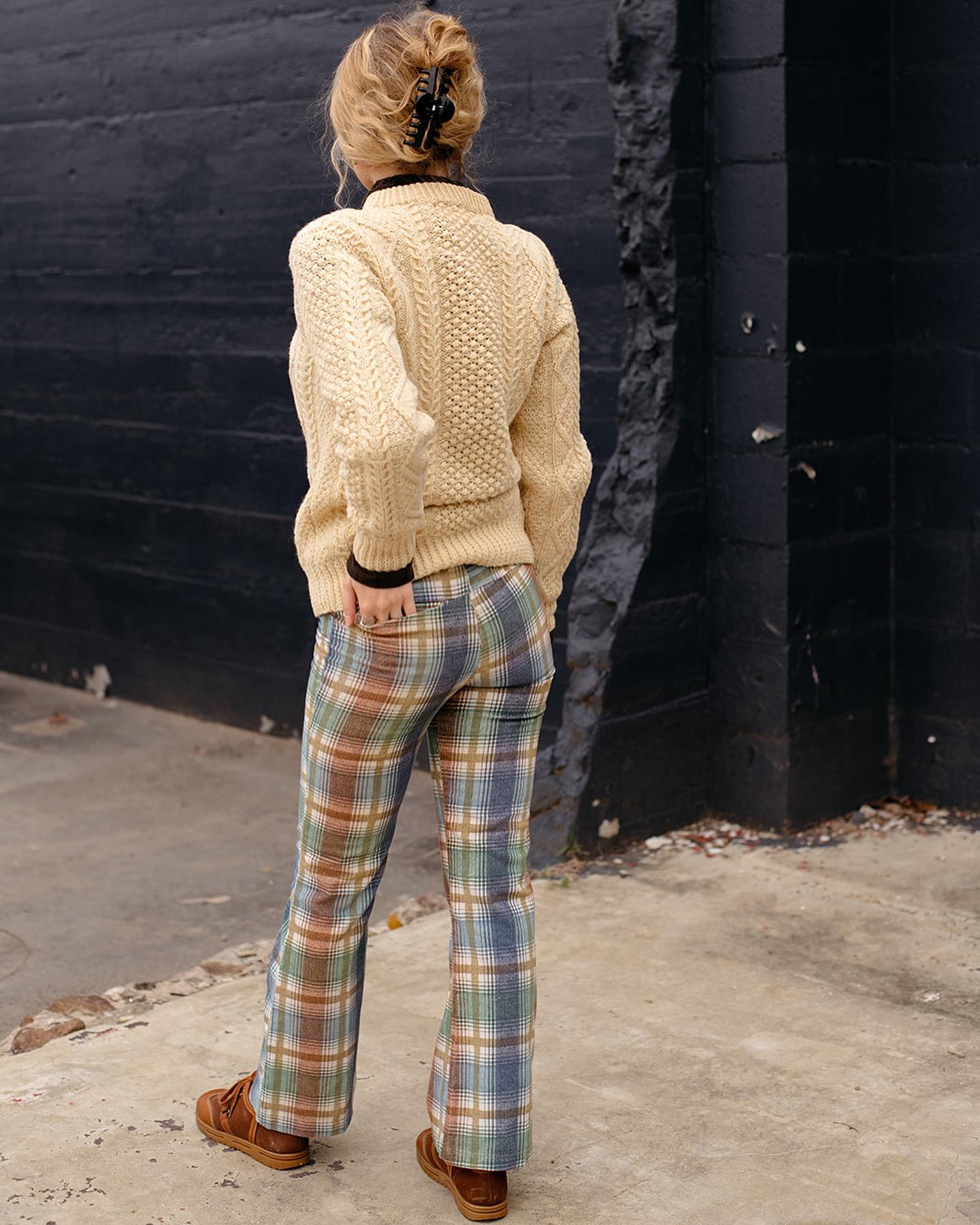 Pair plaid pants with a cable knit sweater