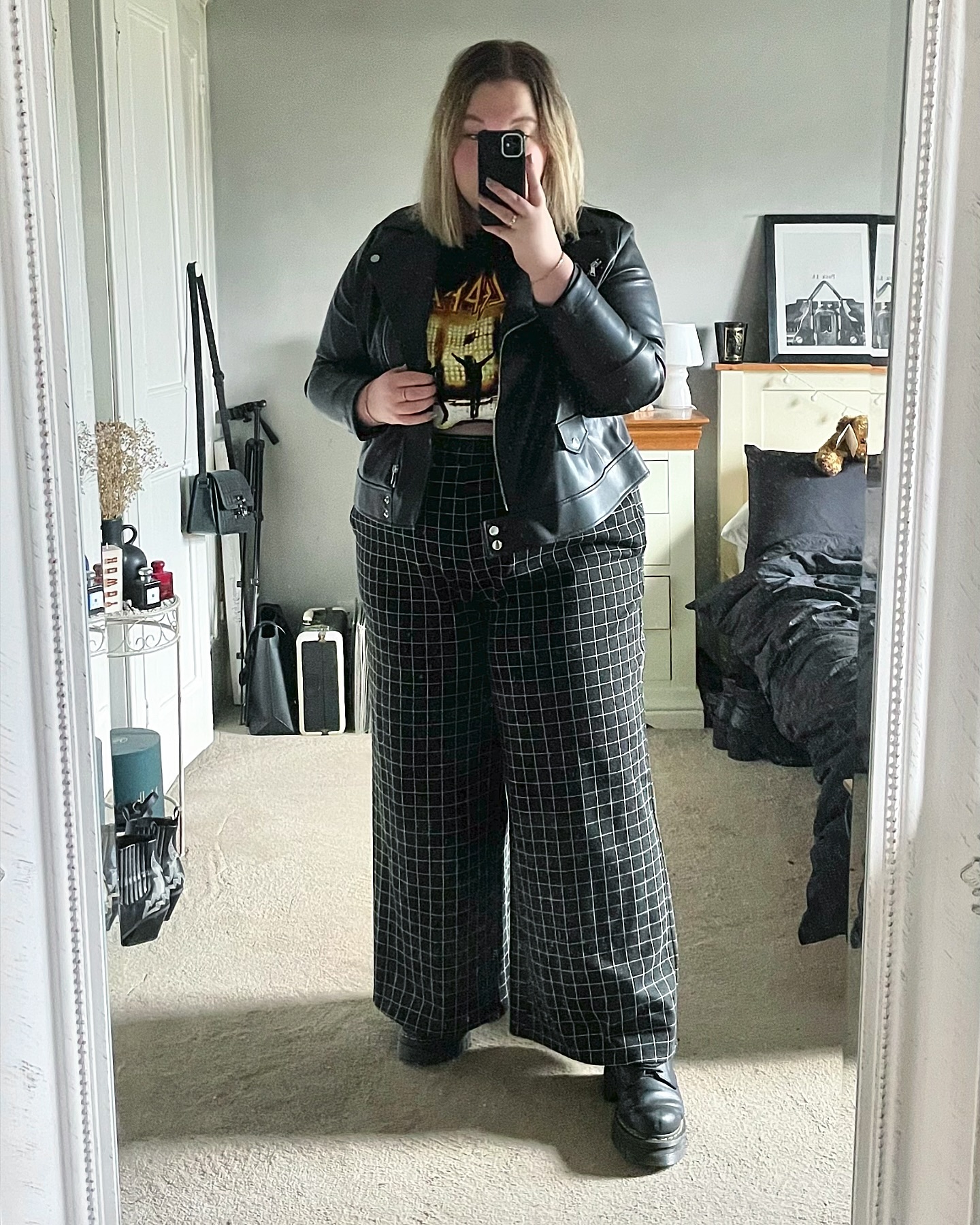 Plaid pants with faux leather jacket