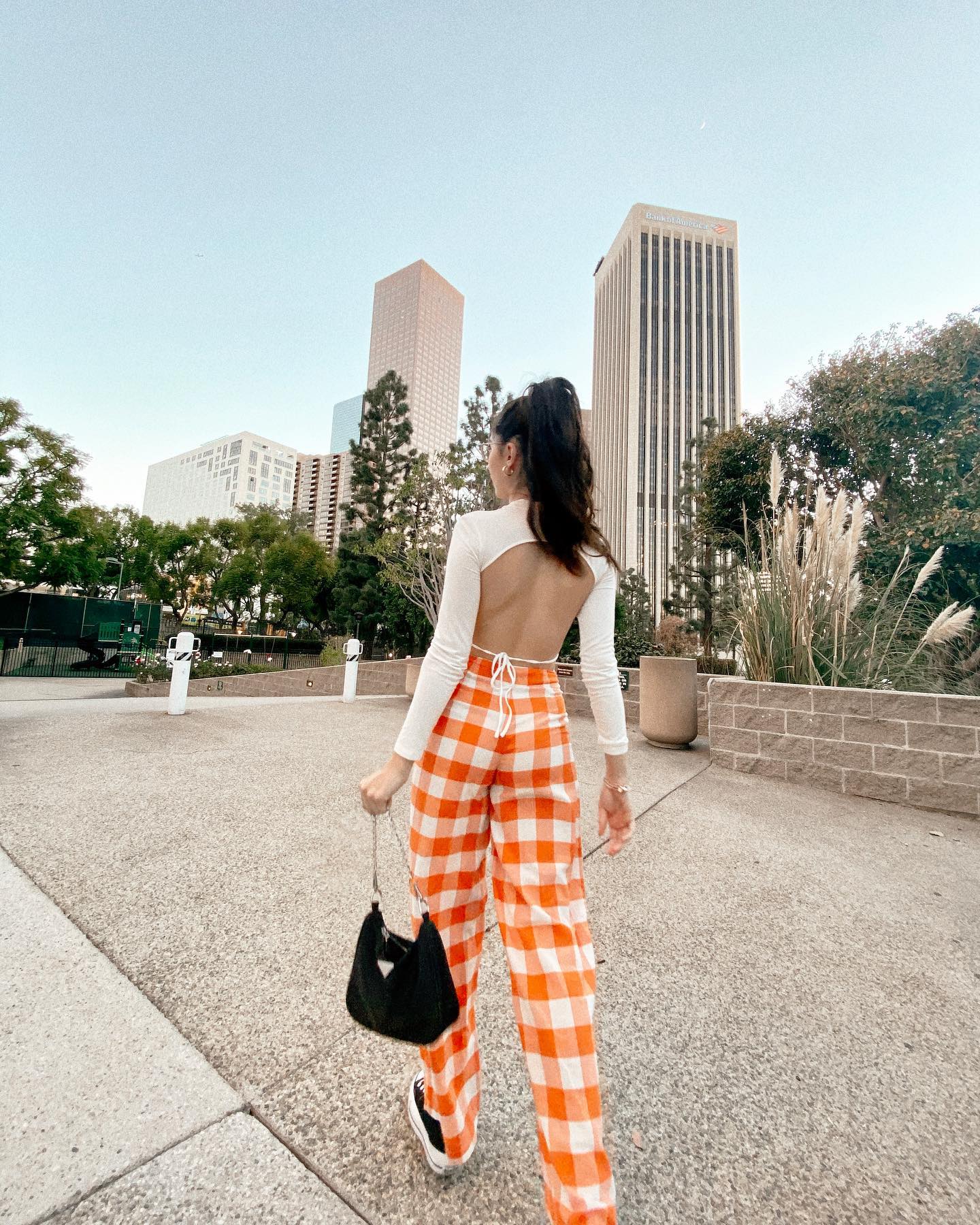 Wearing plaid pants with a fitted open-back top