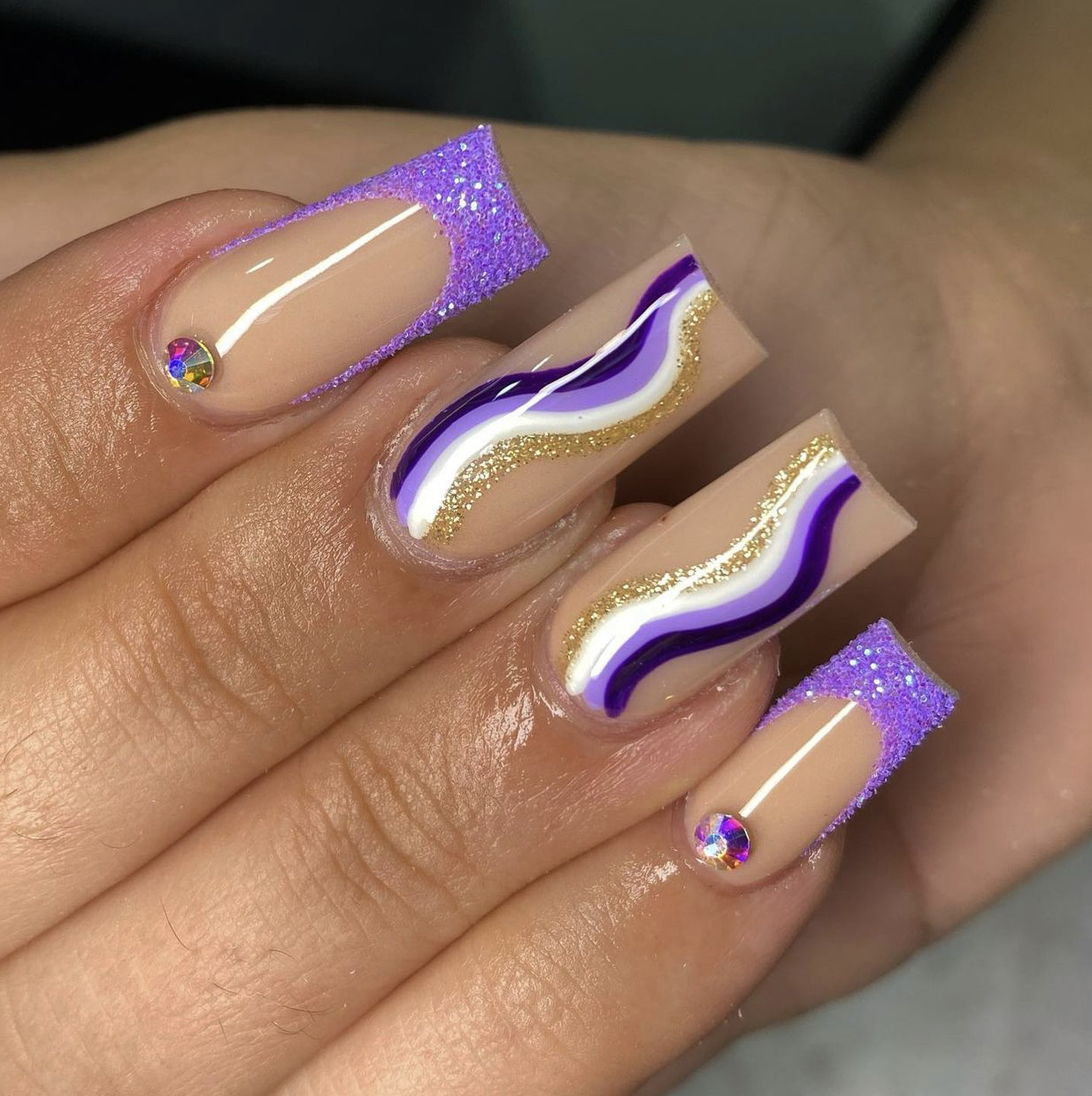 Nude Nails With Purple And Glitter Designs