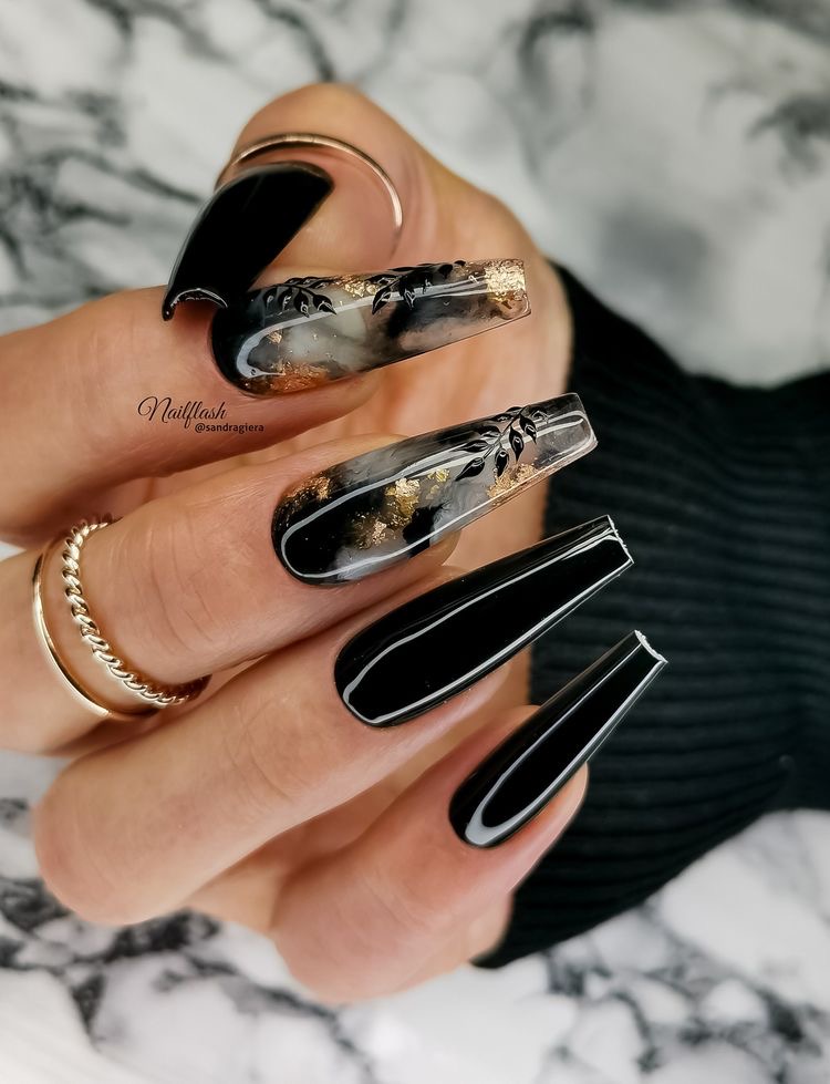 9. Black Coffin Nails With Gold Flakes And Leaf Designs