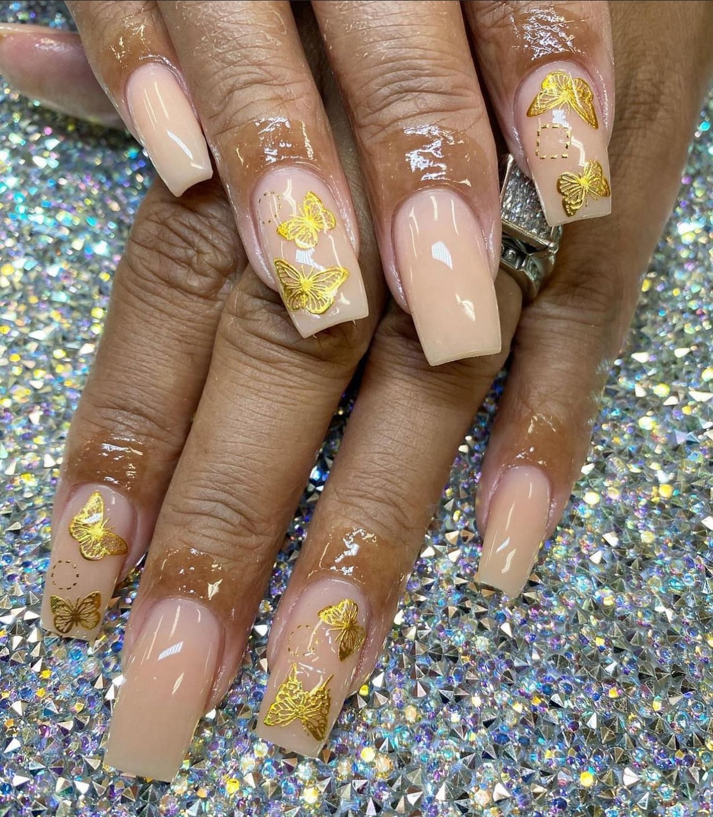 Nude Acrylic Nails With Gold Butterflies