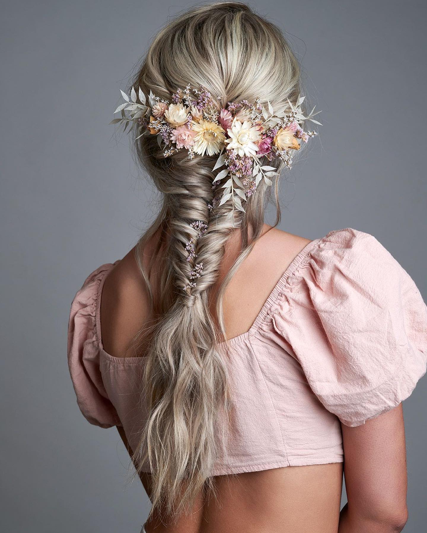 Artful Fishtail Braids With Flowers