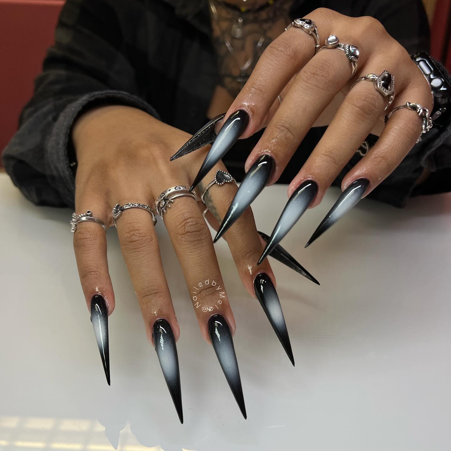 Black airbrushed stiletto nails