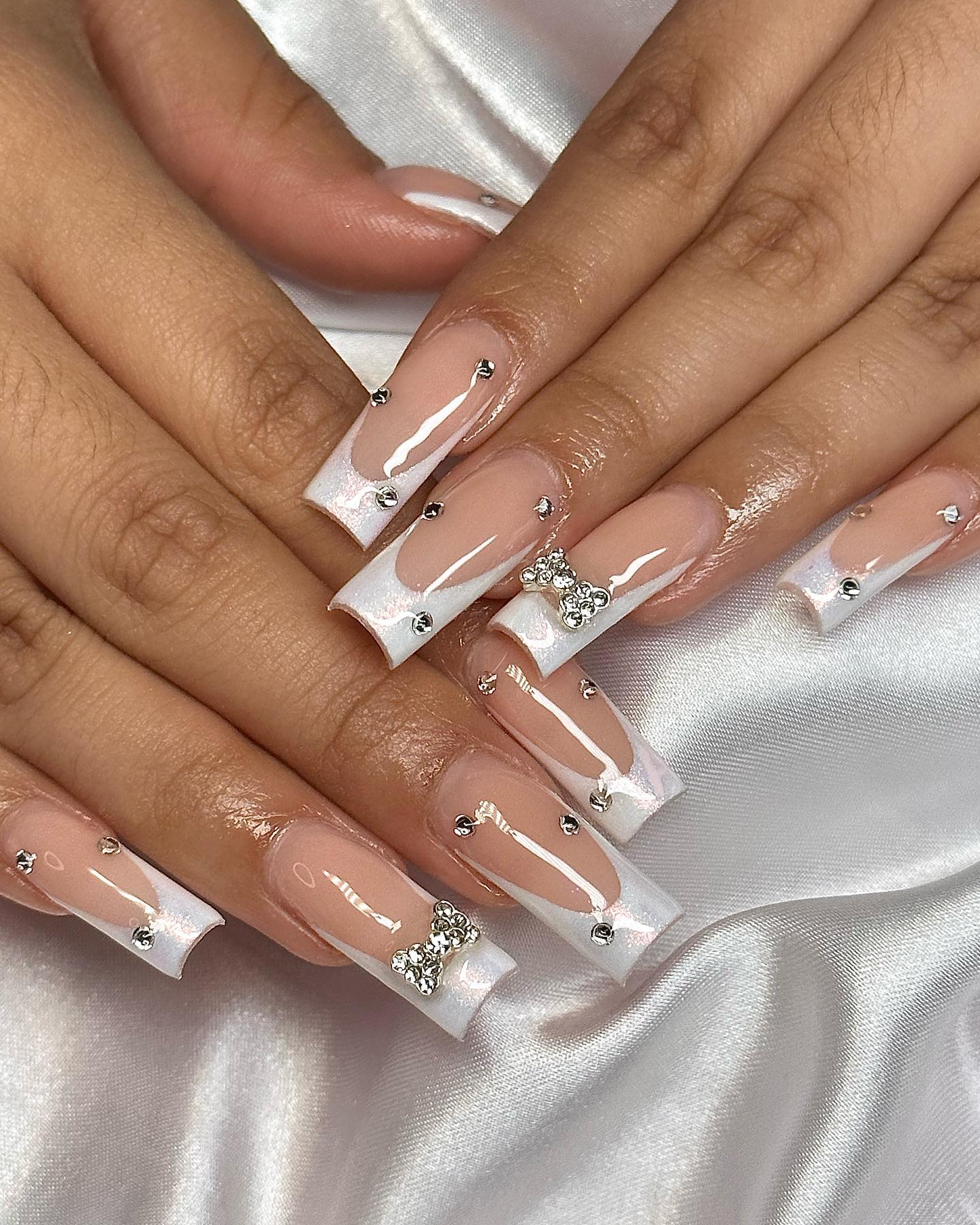 French Chrome Nails Adorned With Studs And Bow