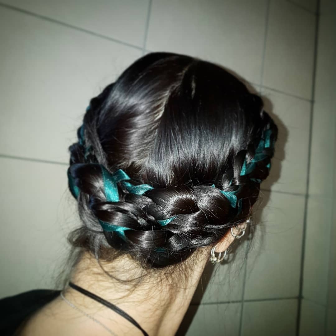 Milkmaid braids with green ribbons