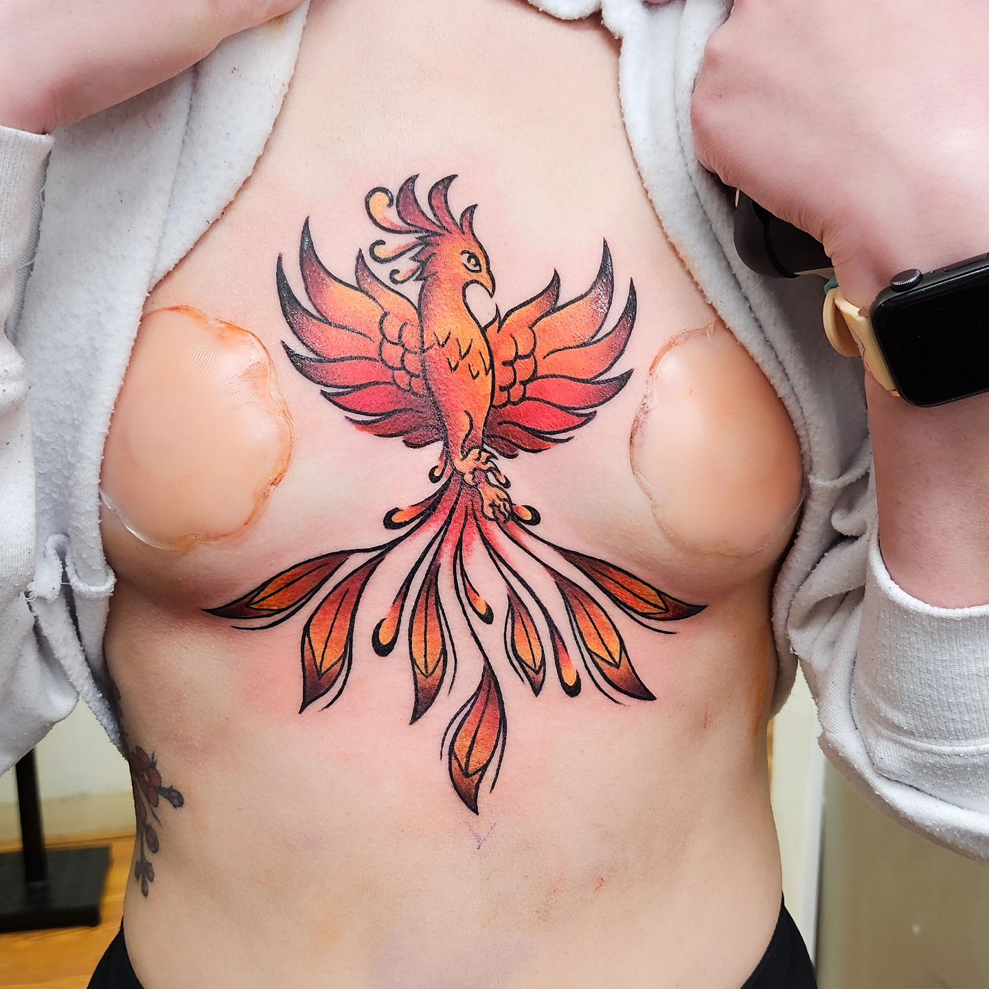 Sternum Phoenix Tattoo