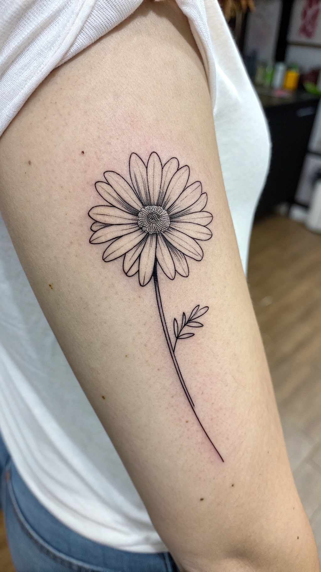 Tiny Daisy Tattoo