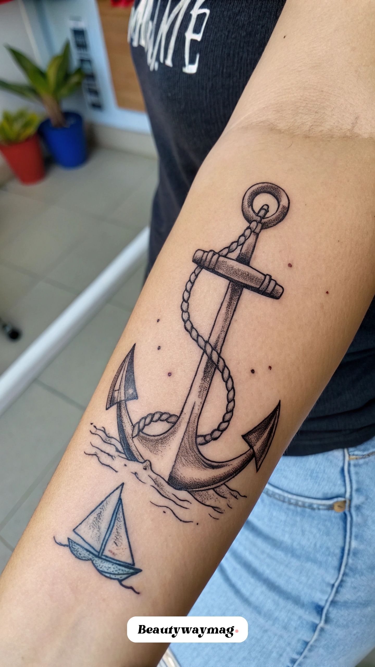 Anchor with Small Sailboat