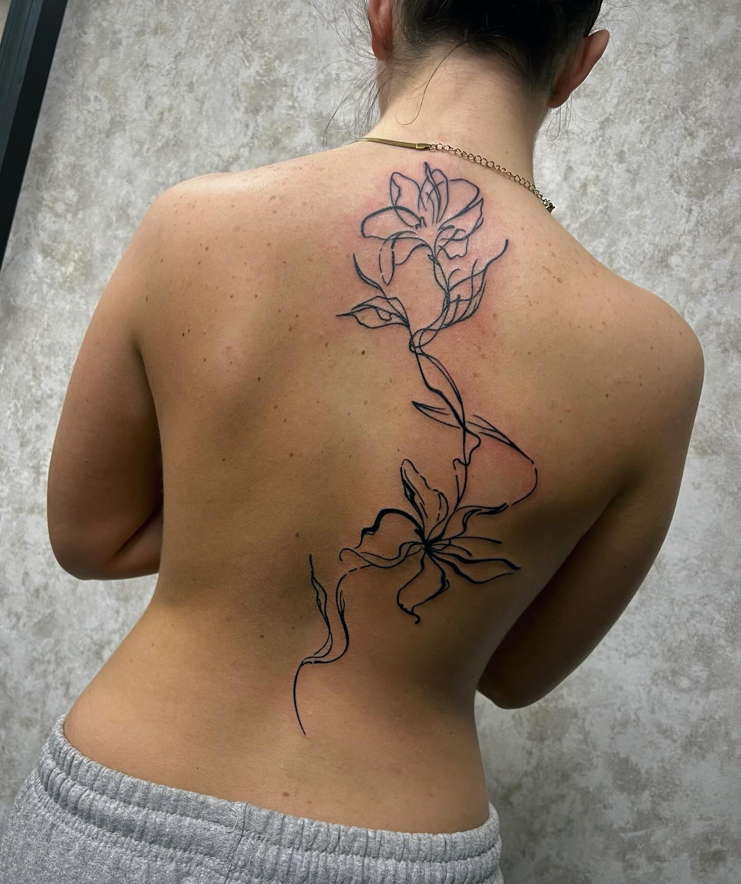 Abstract Floral Backpiece Tattoo