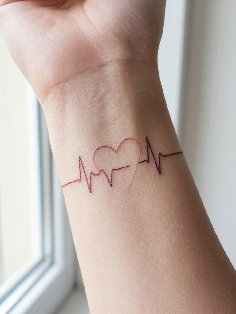 Macro shot of a heart tattoo on a woman's inner wrist with a continuous heartbeat line trailing from it, the line thin and delicate. Soft, natural window light. Simple and deeply personal.