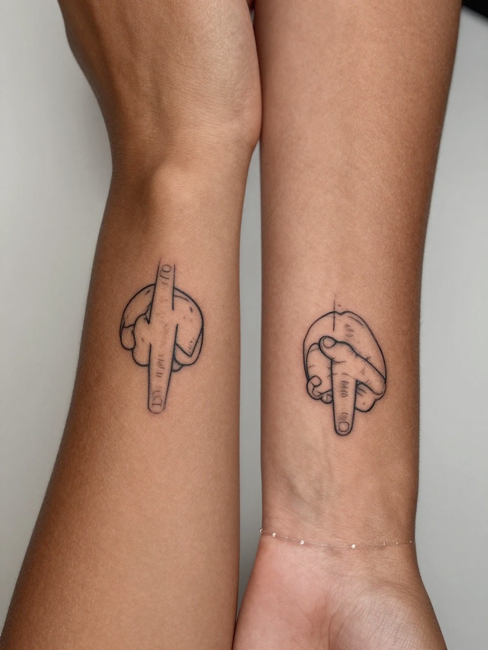 "macro shot of matching pinky promise line tattoos on deep brown skin, one on each inner arm, fine line black ink, minimalist hand gesture design, realistic skin texture, delicate bracelet visible, tight crop, design-first composition, soft neutral background, tattoo inspiration image (no watermarks on images)"