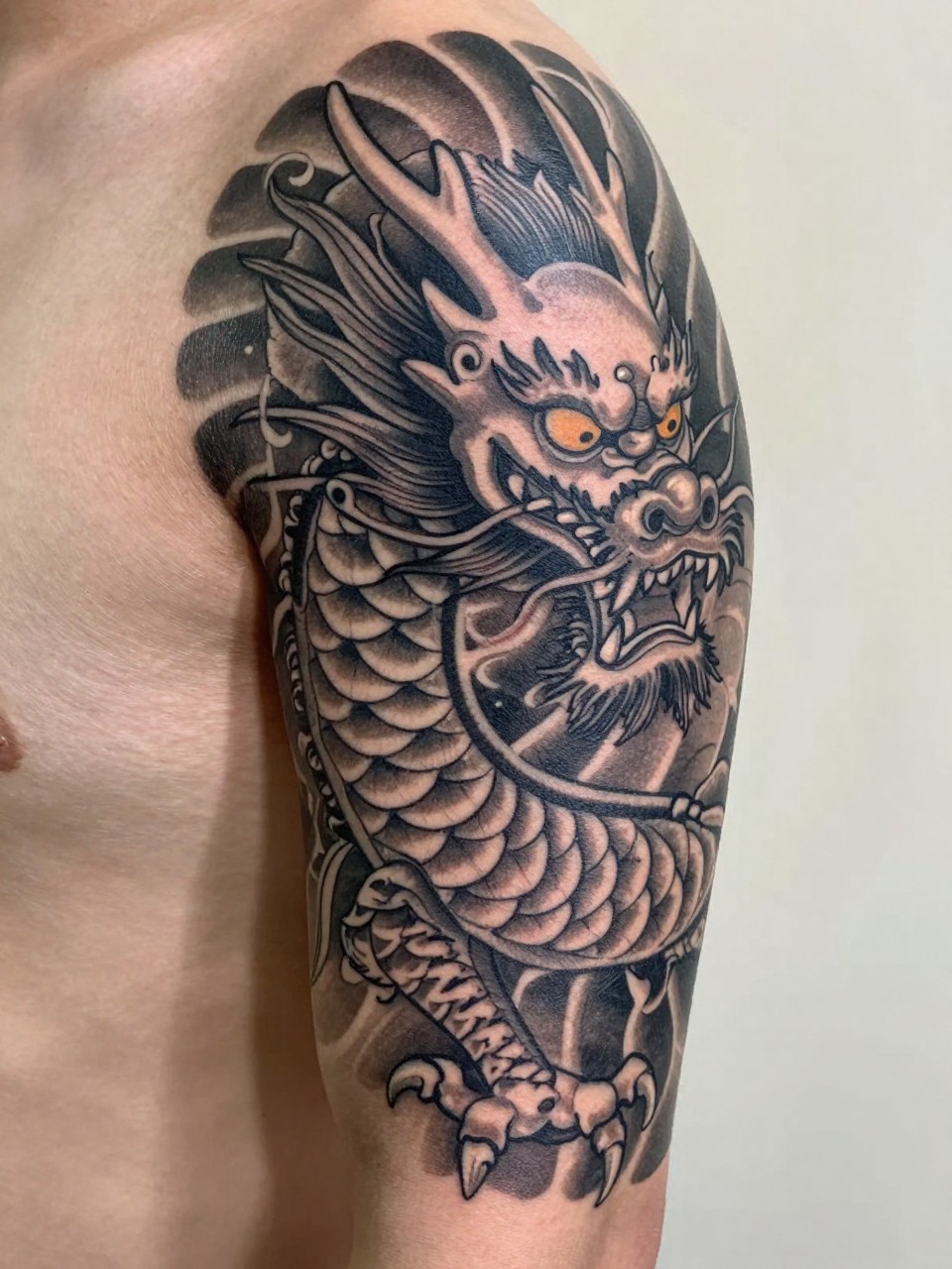 extreme close-up of a traditional Japanese dragon sleeve tattoo on the arm, detailed scales, flowing whiskers, curved claws, bold black and grey ink, strong traditional linework, soft shading, realistic skin texture, design-focused close-up, minimal neutral background, modern tattoo inspiration photography (no watermarks on images)