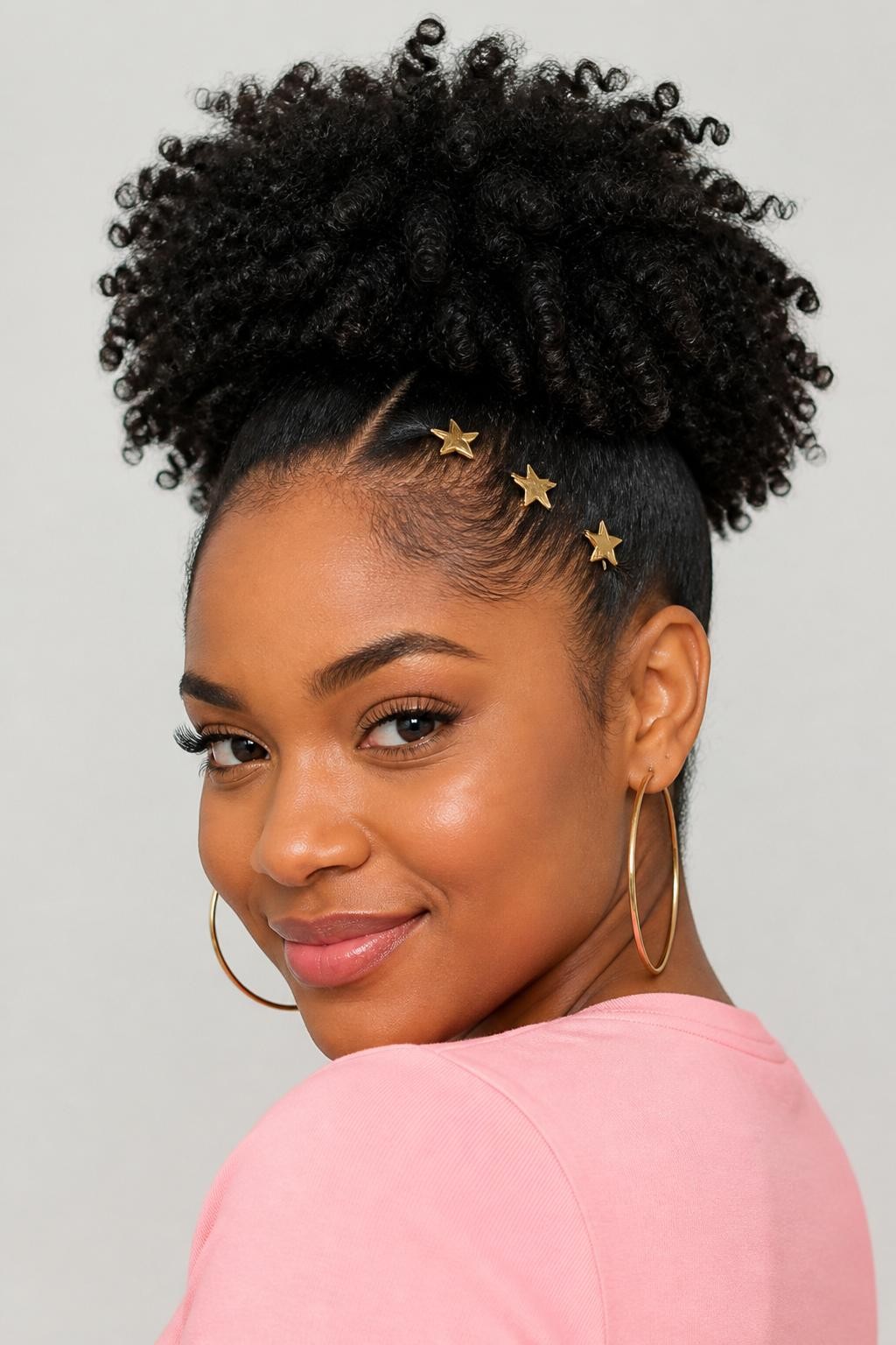 Image Prompt:
A realistic portrait photo of a black woman with medium-length coily natural hair styled into a high curly puff, three tiny gold star clips placed along one side near the hairline, full textured puff shape, soft laid edges, warm brown skin, hoop earrings, pastel pink top, bright clean studio background, playful natural hair inspiration, high-resolution DSLR photo, no text, (no watermarks on images)