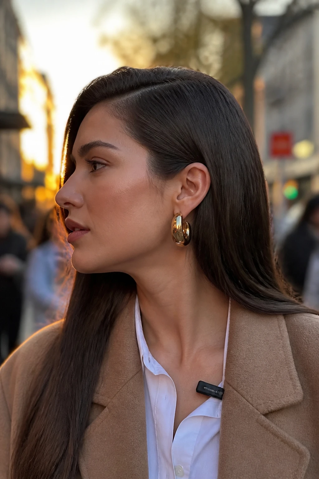 Image prompt
Photo of a woman wearing long straight hair with a deep side part and one side tucked neatly behind her ear, side profile view highlighting the part and statement earring, softly blurred city street background, golden hour glow, containing a small lived-in detail such as a slim clip attached to her collar, realistic candid moment, latest iPhone photo quality.