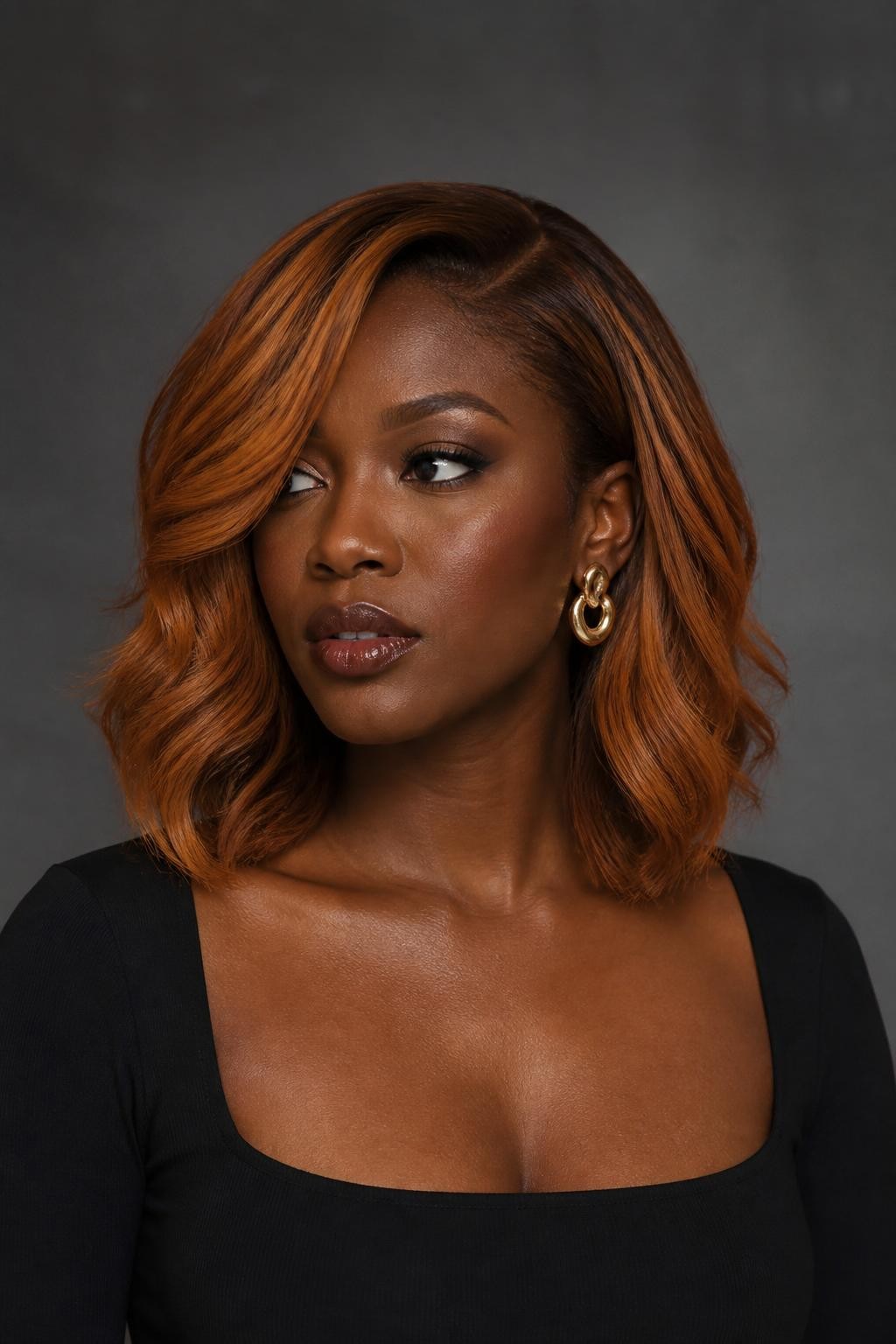 A realistic editorial portrait of a Black woman with rich dark skin wearing a softly angled collarbone-length lob, burnished apricot strawberry blonde color, deep warm chestnut root melt, rich apricot-copper mid-lengths, muted strawberry-gold highlights along the front and upper layers, slightly deeper bronze-blonde underlayer near the nape, clean side part, loose polished bends, no neon orange or pale yellow sections, black square-neck top, sculptural gold earrings, warm gray studio background, controlled soft lighting, realistic hairline, accurate pigment depth, natural skin texture.